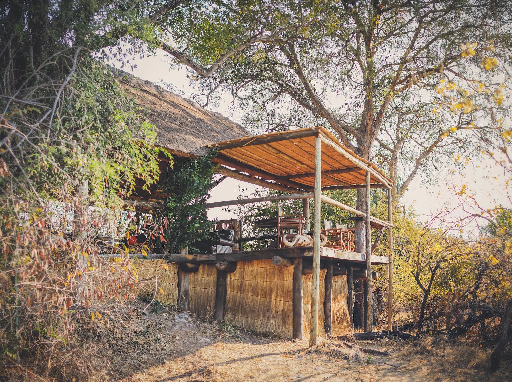 Thatched chalet and open landscape at Ntemwa-Busanga Camp